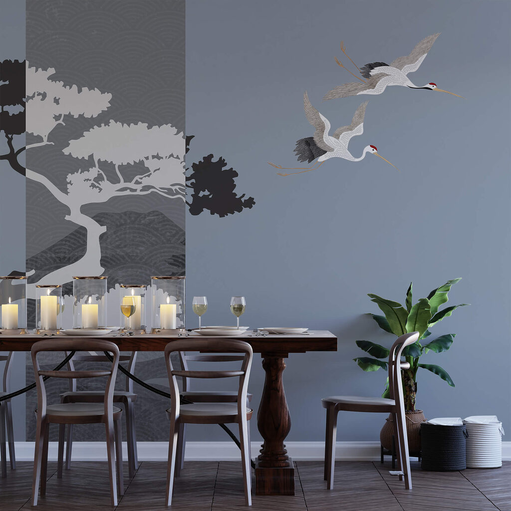 Een paar kraanvogels vliegen naast een boom Een paar kraanvogels vliegen naast een boom