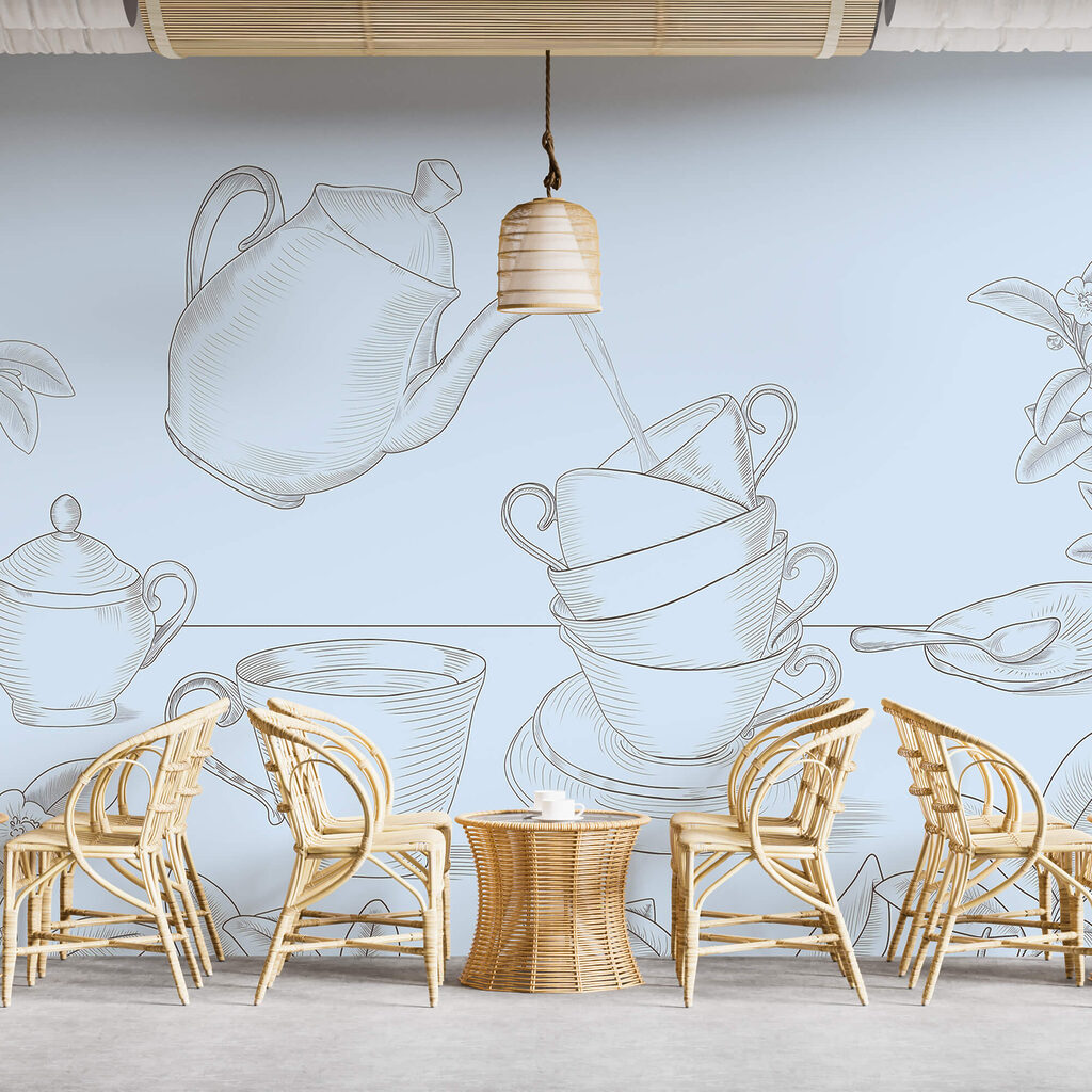 Theepot die in een stapel theekopjes schenkt