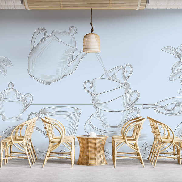 Theepot die in een stapel theekopjes schenkt