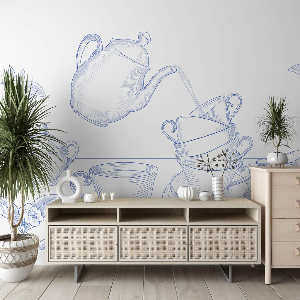 Theepot die in een stapel theekopjes schenkt