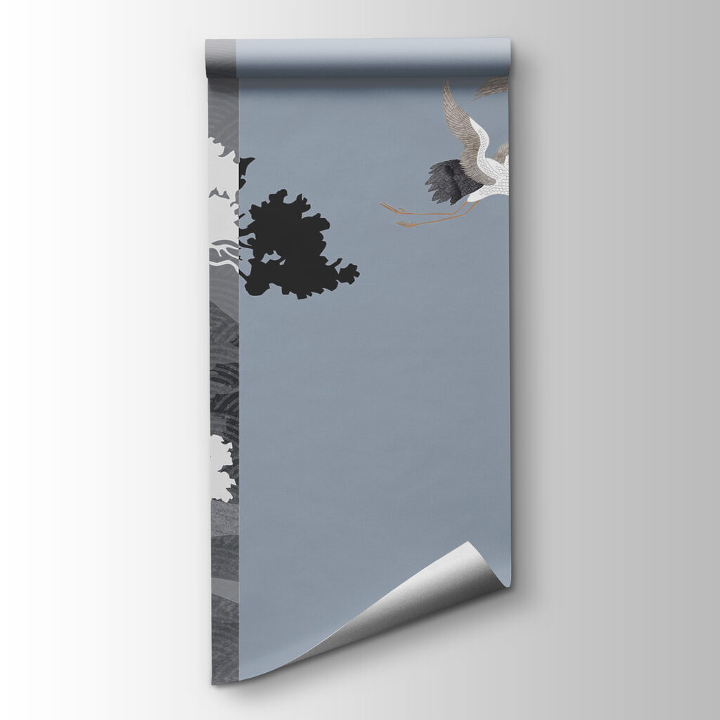 Couple of cranes flying next to a tree Couple of cranes flying next to a tree