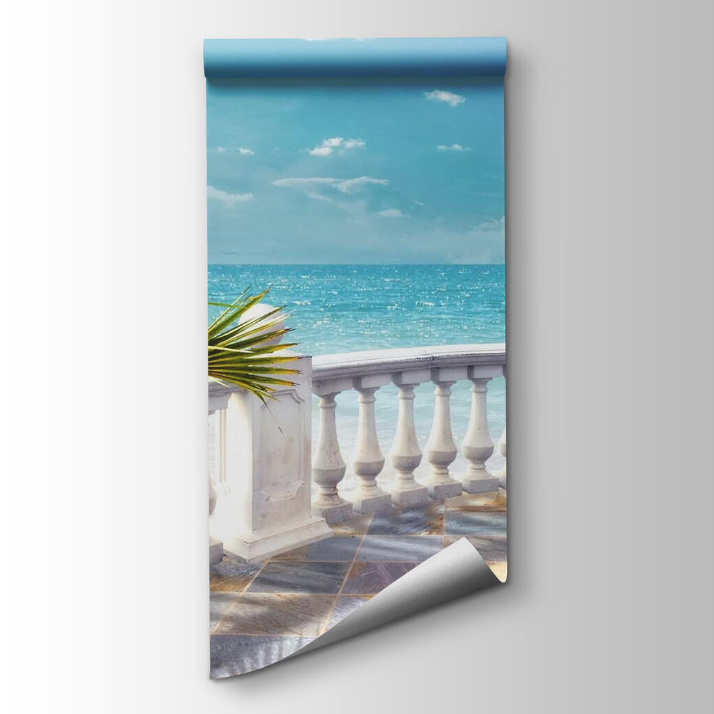 Balcony with a palm tree and a sailboat in the water Balcony with a palm tree and a sailboat in the water