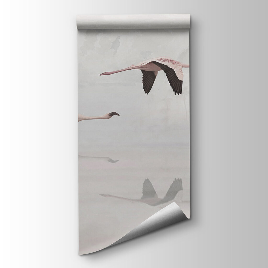 A group of flamingos flying over water A group of flamingos flying over water