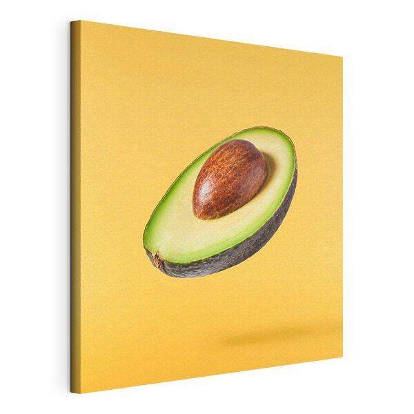 Een avocado doormidden gesneden Canvas Schilderijen Een avocado doormidden gesneden