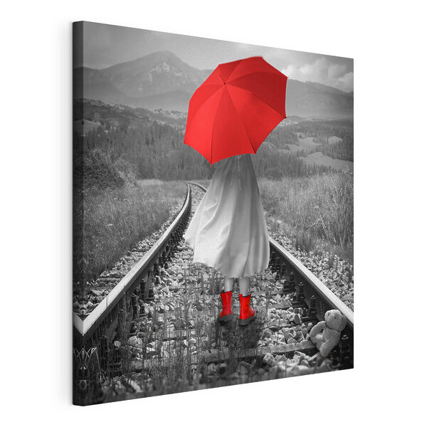 Canvas Schilderijen Een persoon met een rode paraplu op een treinspoor