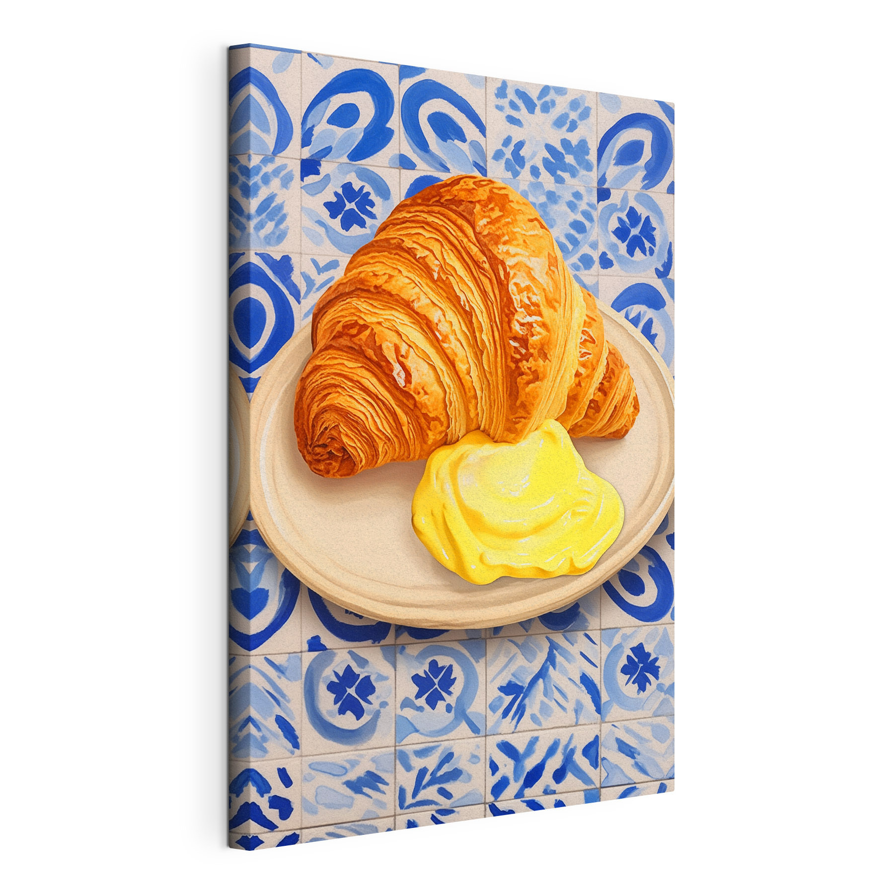 Croissant and a yellow liquid on a plate