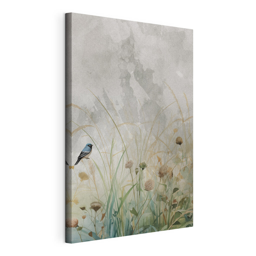 Bird on a branch in a field of grass