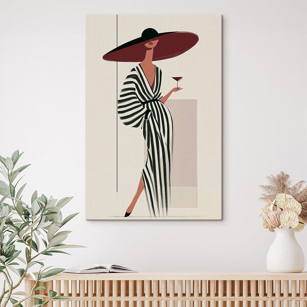 Woman in a striped dress holding a glass of wine Woman in a striped dress holding a glass of wine