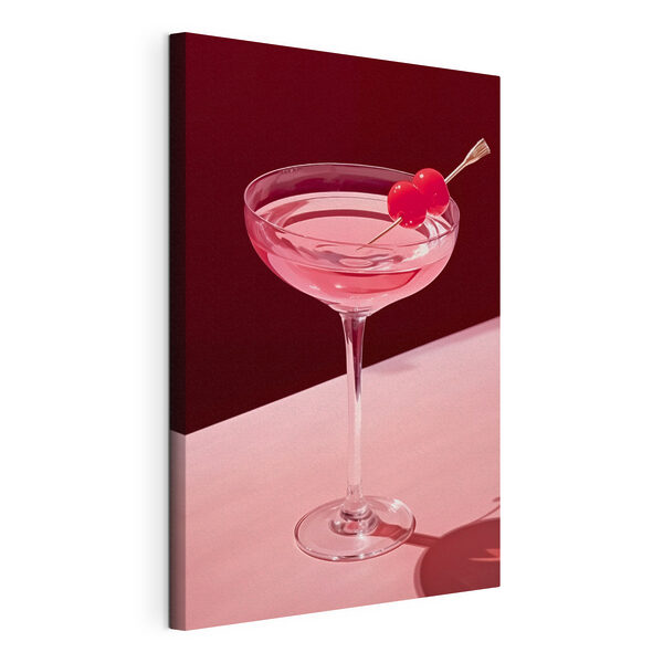 Canvas Schilderijen Glas met roze vloeistof en twee kersen erop