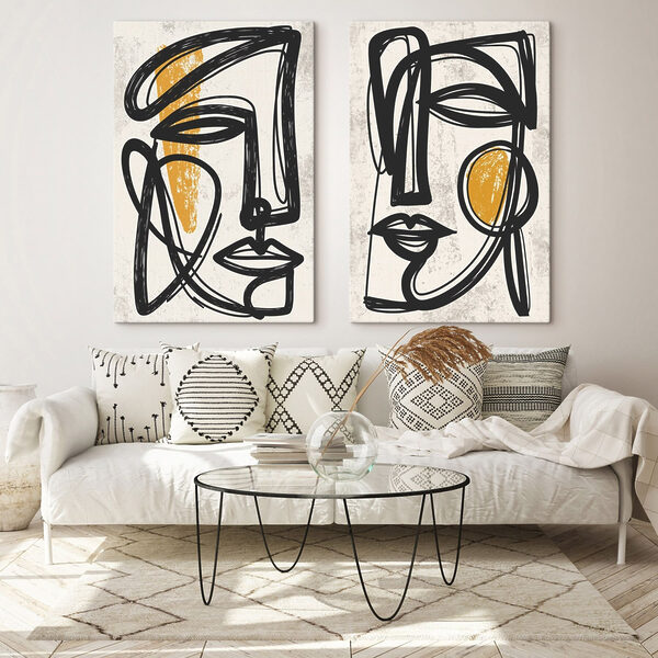 Couple of faces drawn in black and yellow