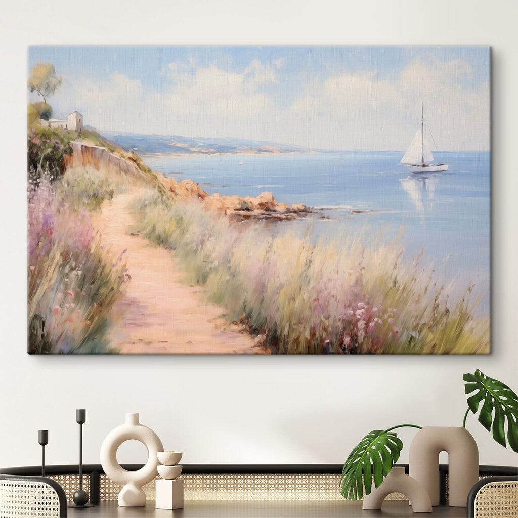Path leading to a body of water with a sailboat