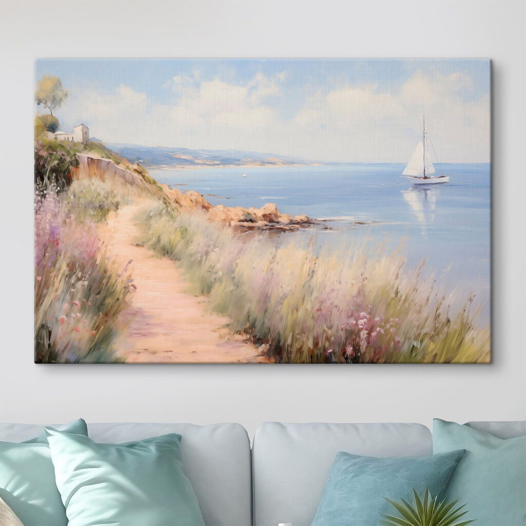 Path leading to a body of water with a sailboat